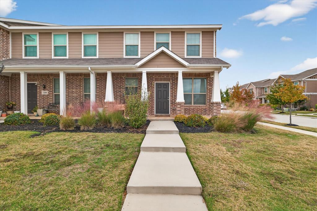 2200 Davenport Drive Denton, TX 76207 - Photo 1 of 23 a front view of a house with yard
