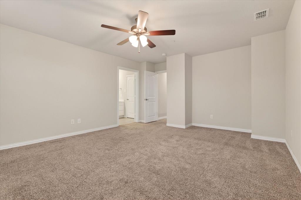 2200 Davenport Drive Denton, TX 76207 - Photo 12 of 23 a view of an empty room with chandelier fan