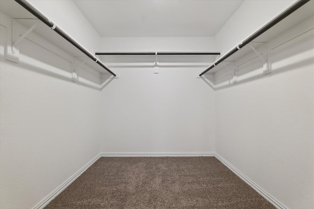 2200 Davenport Drive Denton, TX 76207 - Photo 14 of 23 a view of a room with racks on the wall