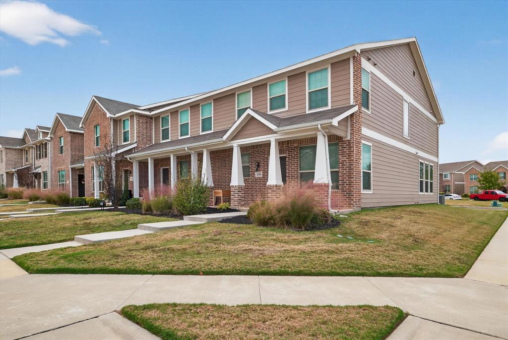 2200 Davenport Drive Denton, TX 76207 - Photo 2 of 23 a front view of a house with a yard