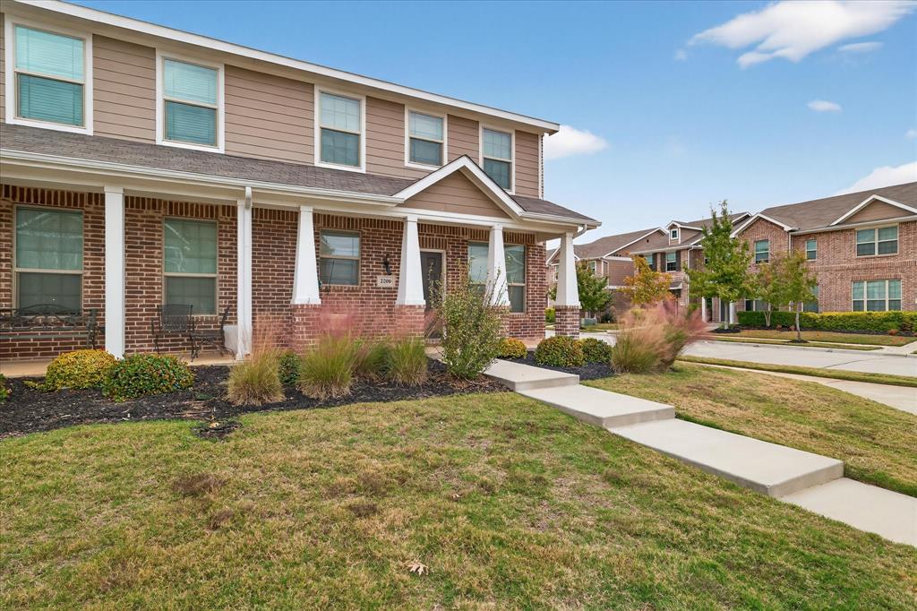 2200 Davenport Drive Denton, TX 76207 - Photo 3 of 23 a front view of a house with garden