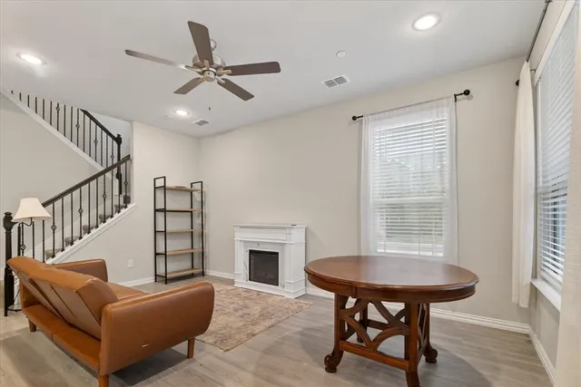 a living room with furniture and a window