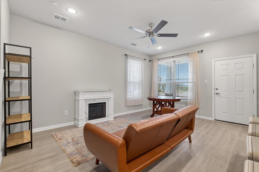 2200 Davenport Drive Denton, TX 76207 - Photo 5 of 23 a living room with furniture and a fireplace
