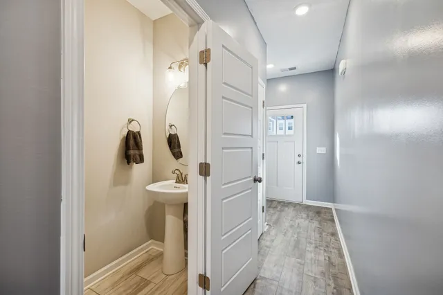 a bathroom with a sink and mirror