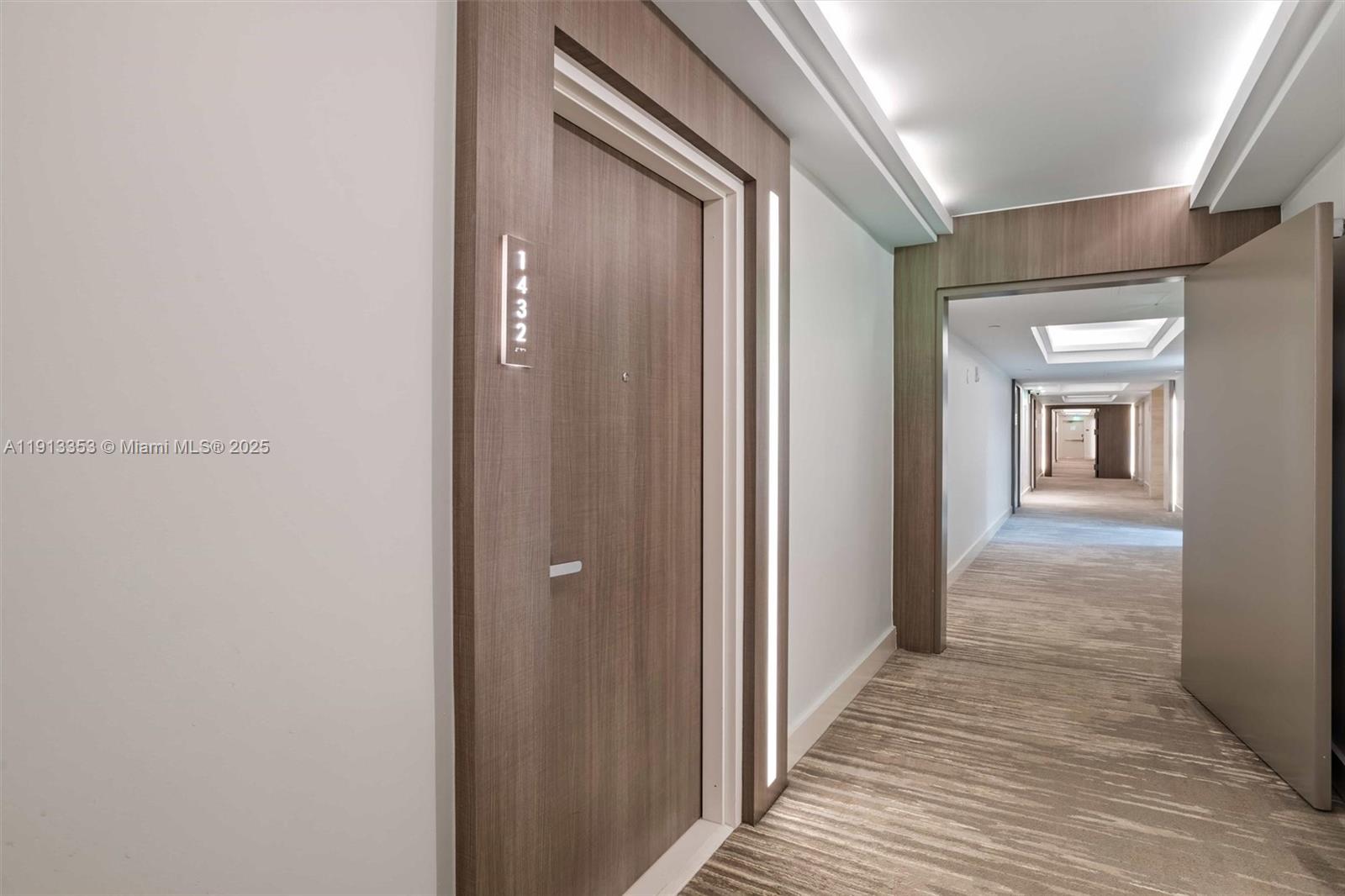 2301 Collins Avenue, Unit 1432 Miami Beach, FL 33139 - Photo 21 of 63 a view of a hallway with wooden floor