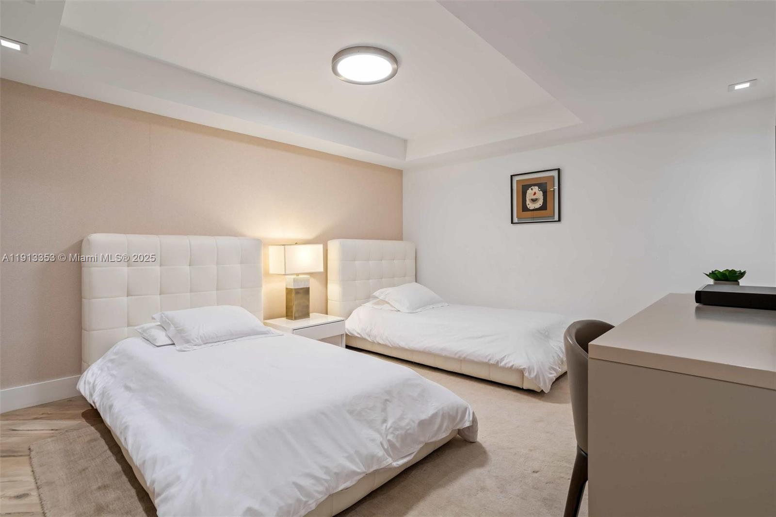 2301 Collins Avenue, Unit 1432 Miami Beach, FL 33139 - Photo 29 of 63 a bedroom with two beds and a desk