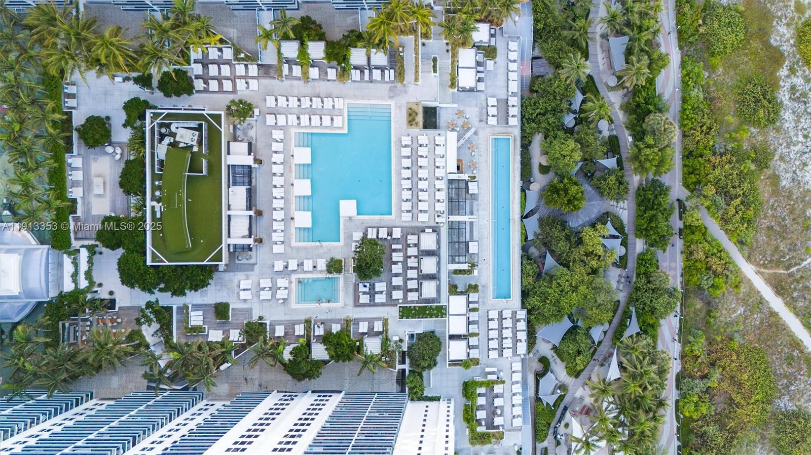 2301 Collins Avenue, Unit 1432 Miami Beach, FL 33139 - Photo 3 of 63 an aerial view of a residential apartment building with a yard