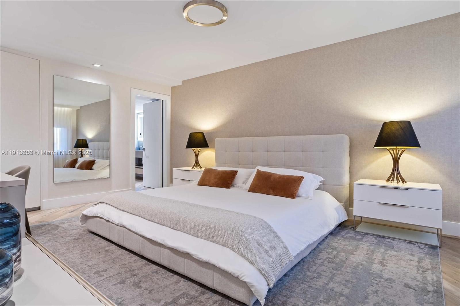 2301 Collins Avenue, Unit 1432 Miami Beach, FL 33139 - Photo 38 of 63 a bedroom with a bed and a lamp