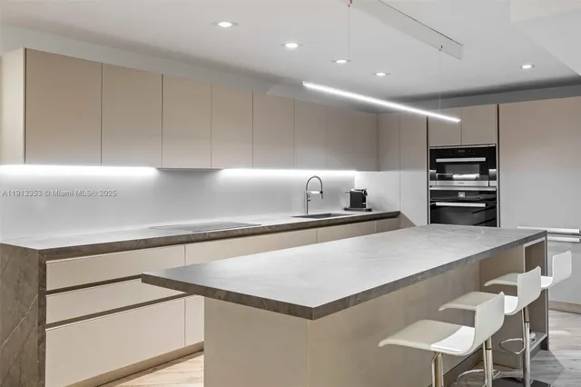 a living room with furniture cabinets and a flat screen tv