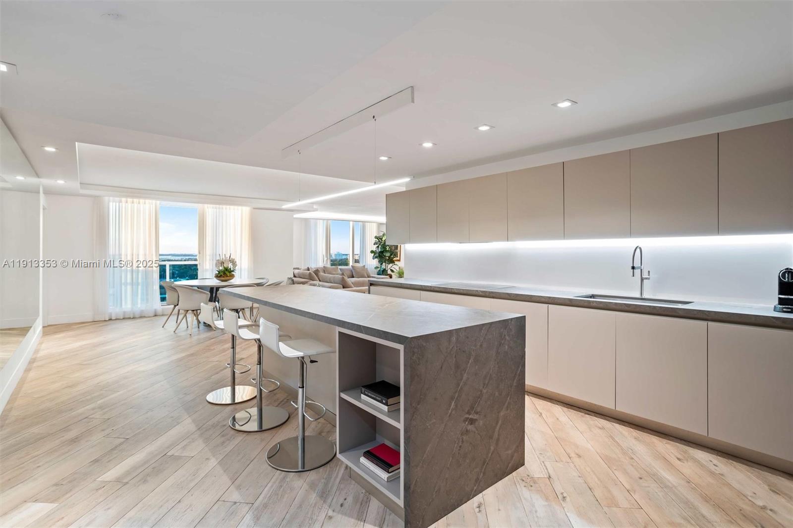 2301 Collins Avenue, Unit 1432 Miami Beach, FL 33139 - Photo 43 of 63 a kitchen with a sink cabinets and wooden floor