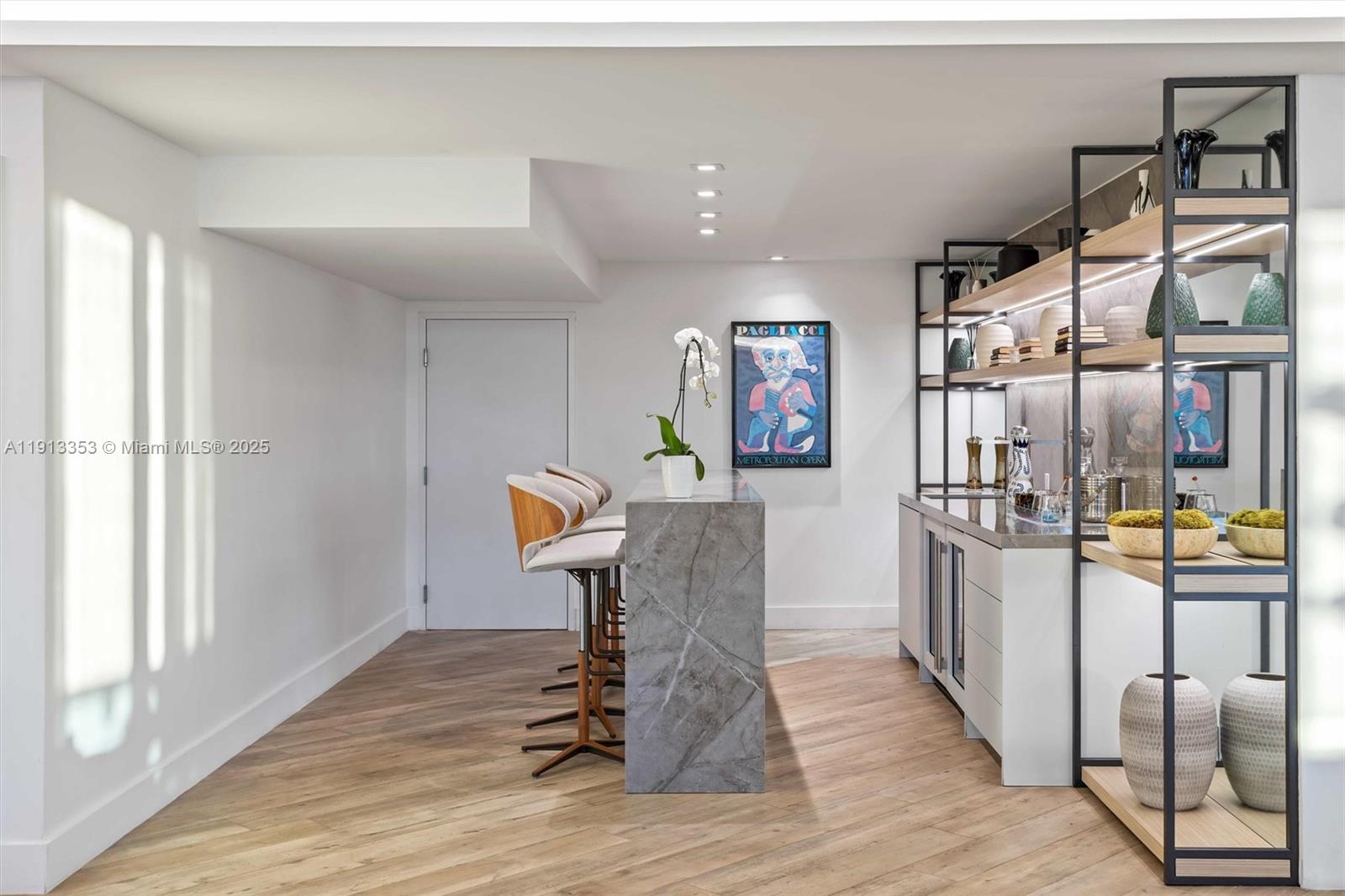 2301 Collins Avenue, Unit 1432 Miami Beach, FL 33139 - Photo 45 of 63 a kitchen with stainless steel appliances kitchen island granite countertop a refrigerator and a stove