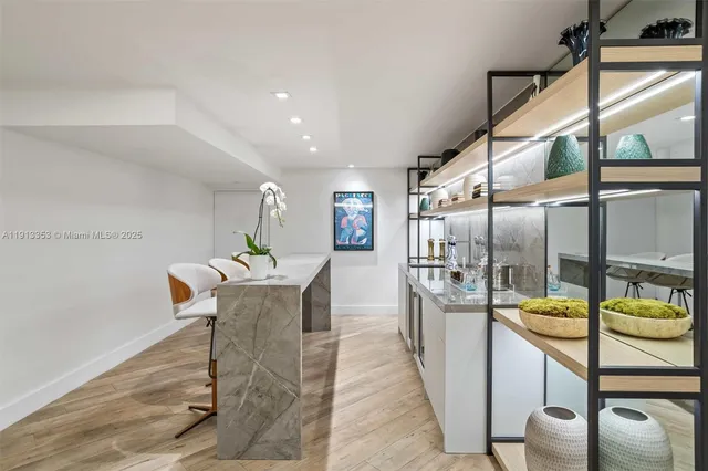 a living room with furniture a flat screen tv and a large window