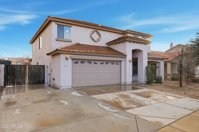 a front view of a house with a garage