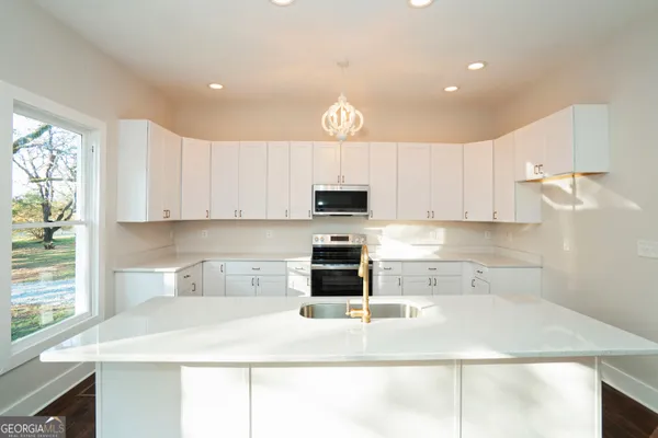 a view of an empty room and wooden floor