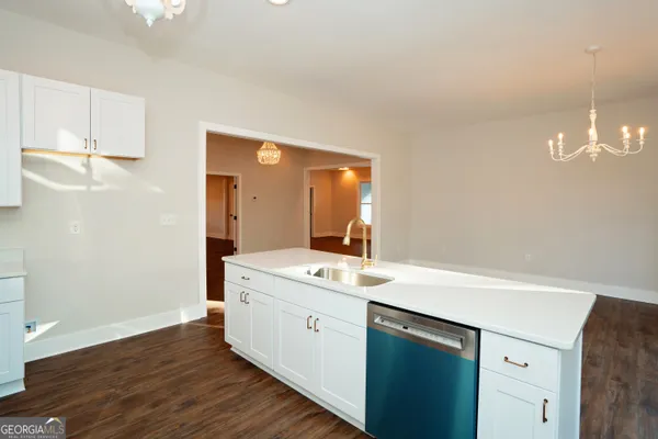 a bathroom with a double vanity sink toilet and mirror