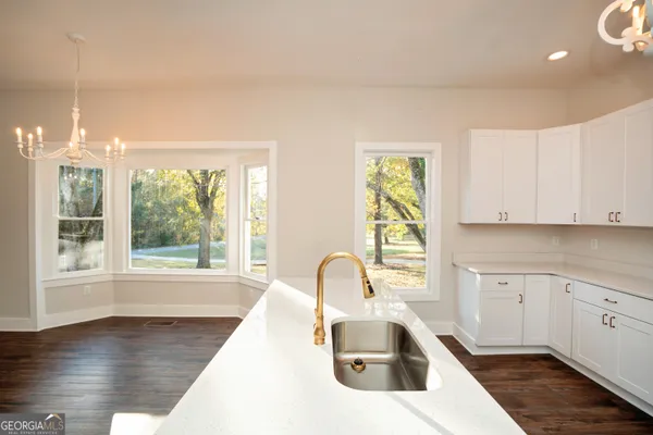 a bathroom with a shower and a sink