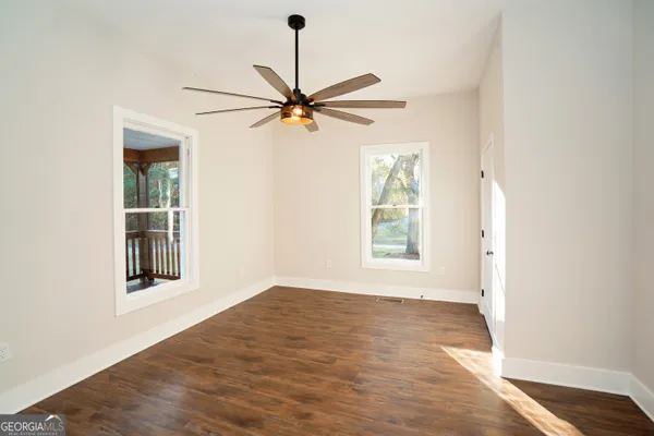 a view of a kitchen cabinets and wooden floor