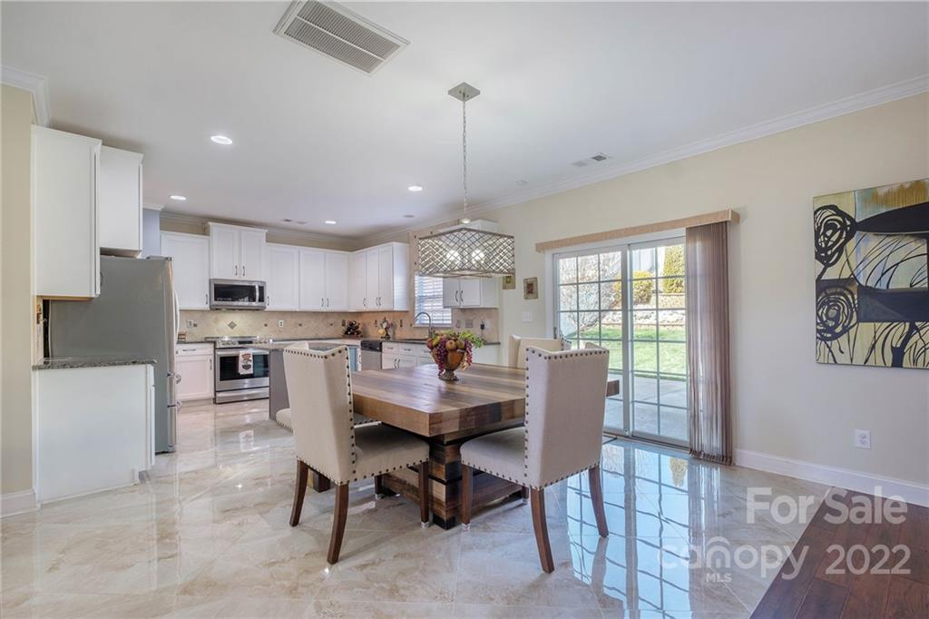 14410 Winged Teal Road Charlotte, NC 28278 - Photo 13 of 38 a dining room with furniture and window