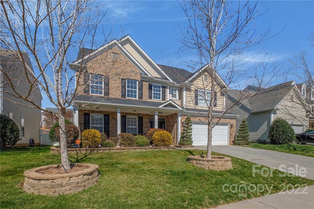 14410 Winged Teal Road Charlotte, NC 28278 - Photo 2 of 38 a front view of a house with a yard