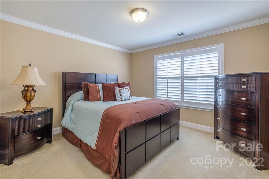 14410 Winged Teal Road Charlotte, NC 28278 - Photo 25 of 38 a bedroom with a bed and a closet