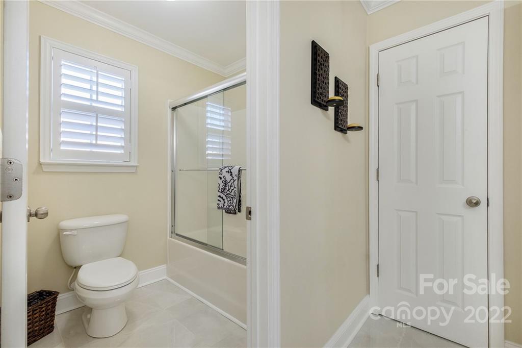 14410 Winged Teal Road Charlotte, NC 28278 - Photo 28 of 38 a white toilet sitting next to a bathroom sink