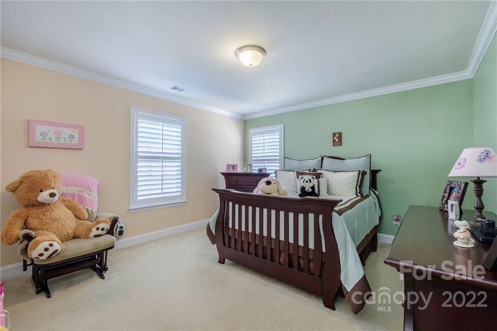 14410 Winged Teal Road Charlotte, NC 28278 - Photo 29 of 38 a bedroom with furniture and a window