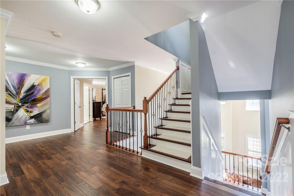 14410 Winged Teal Road Charlotte, NC 28278 - Photo 30 of 38 a view of a hallway with wooden floor and stairs