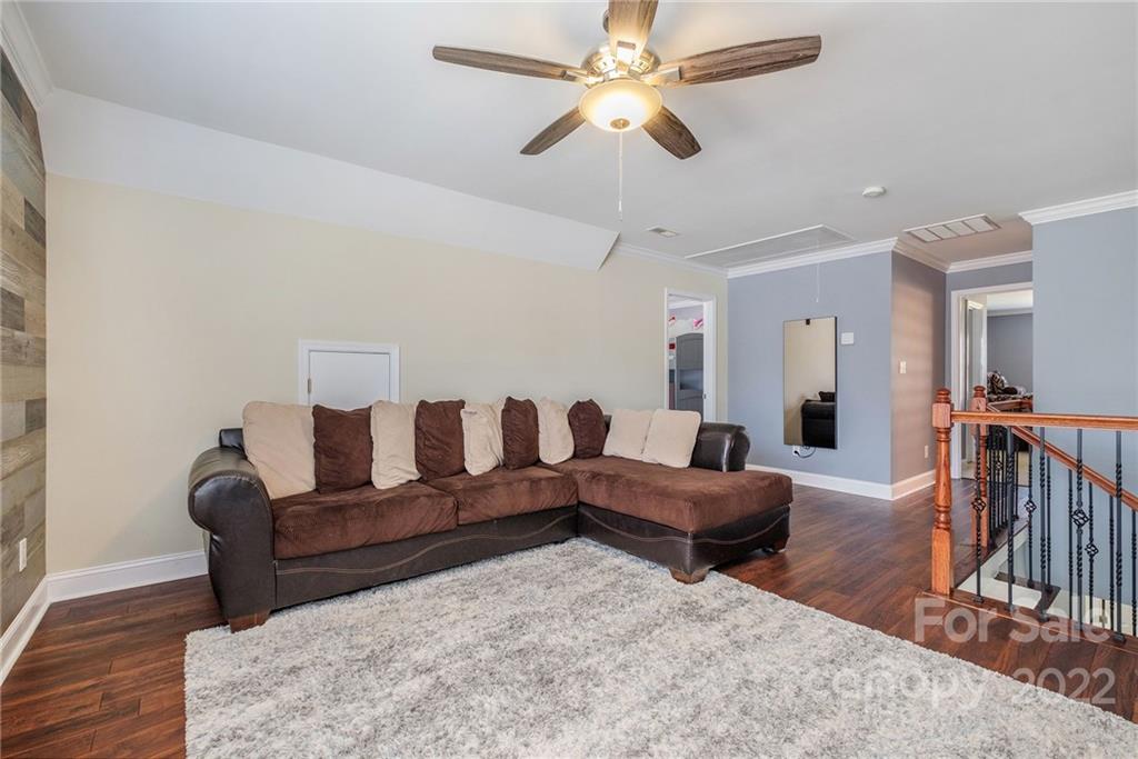 14410 Winged Teal Road Charlotte, NC 28278 - Photo 32 of 38 a living room with furniture and wooden floor