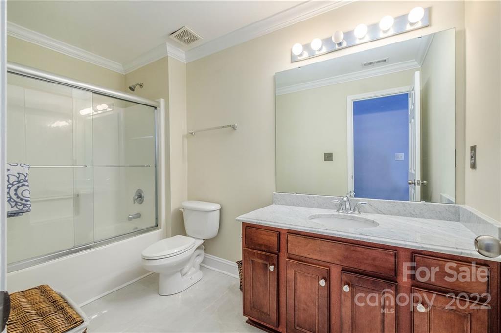 14410 Winged Teal Road Charlotte, NC 28278 - Photo 34 of 38 a bathroom with a sink a toilet and shower