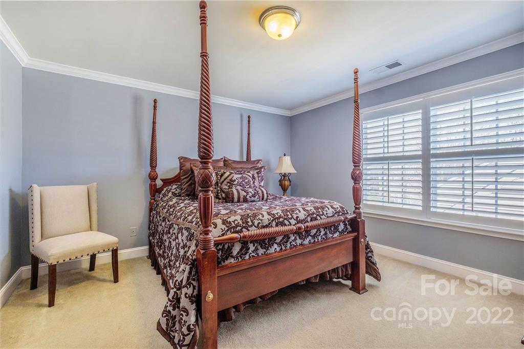 14410 Winged Teal Road Charlotte, NC 28278 - Photo 35 of 38 a bedroom with a bed chair and window