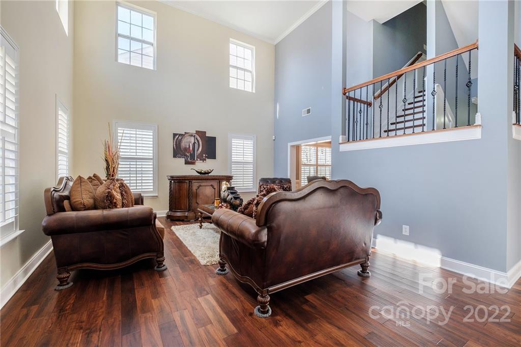 14410 Winged Teal Road Charlotte, NC 28278 - Photo 4 of 38 a living room with furniture and a wooden floor