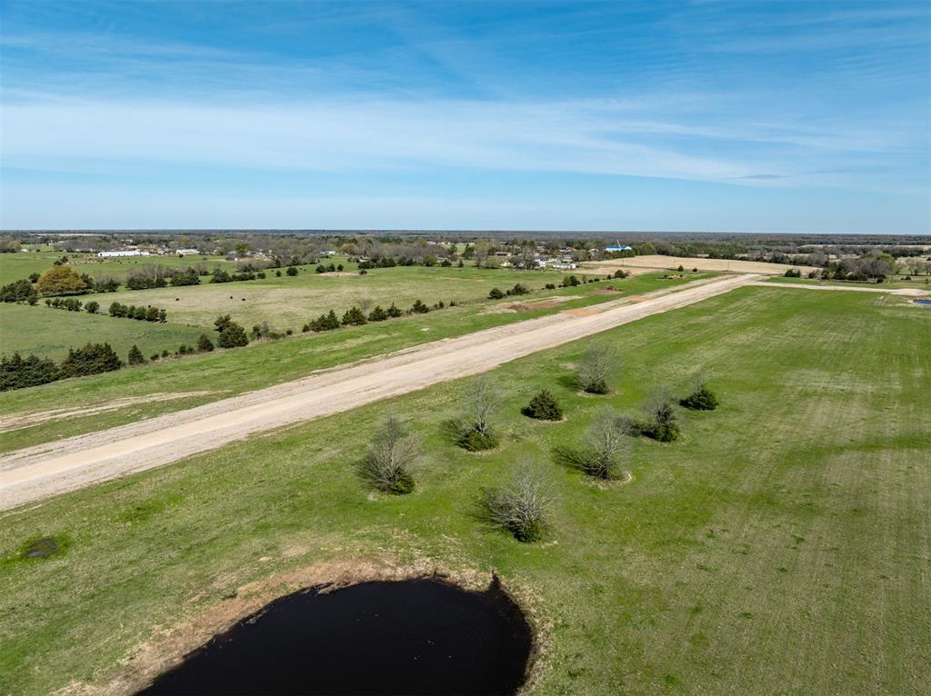 275 Private Road Paris, TX 75460 - Photo 3 of 8 a view of a field with an ocean view