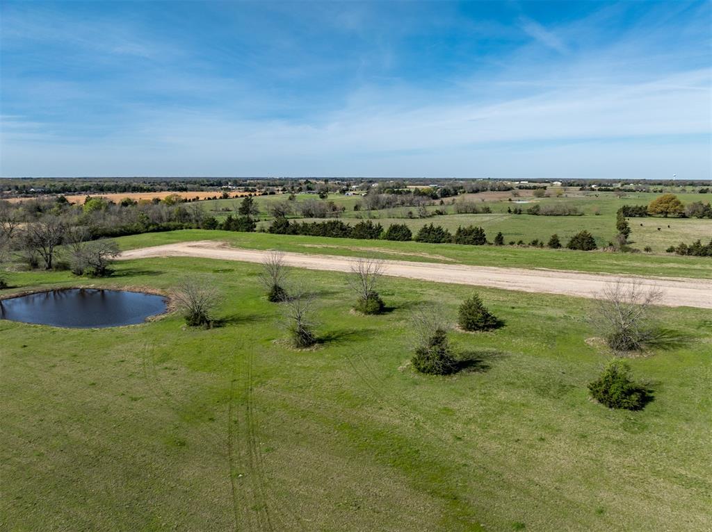 275 Private Road Paris, TX 75460 - Photo 4 of 8 a view of a lake with outdoor space