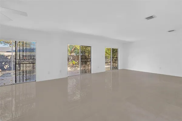 a kitchen with stainless steel appliances granite countertop a refrigerator stove and microwave