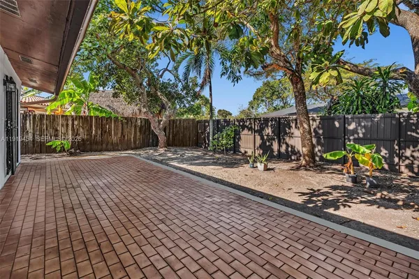a view of a backyard of the house