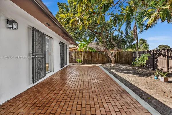 a view of backyard with garage