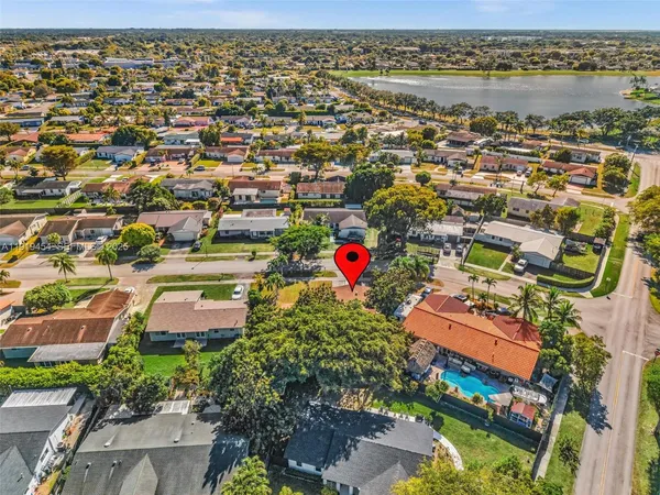 an aerial view of residential houses with outdoor space