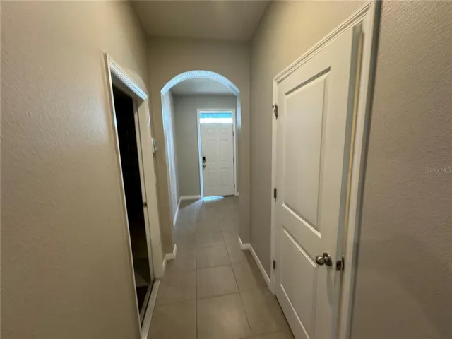 a view of a bathroom from a hallway