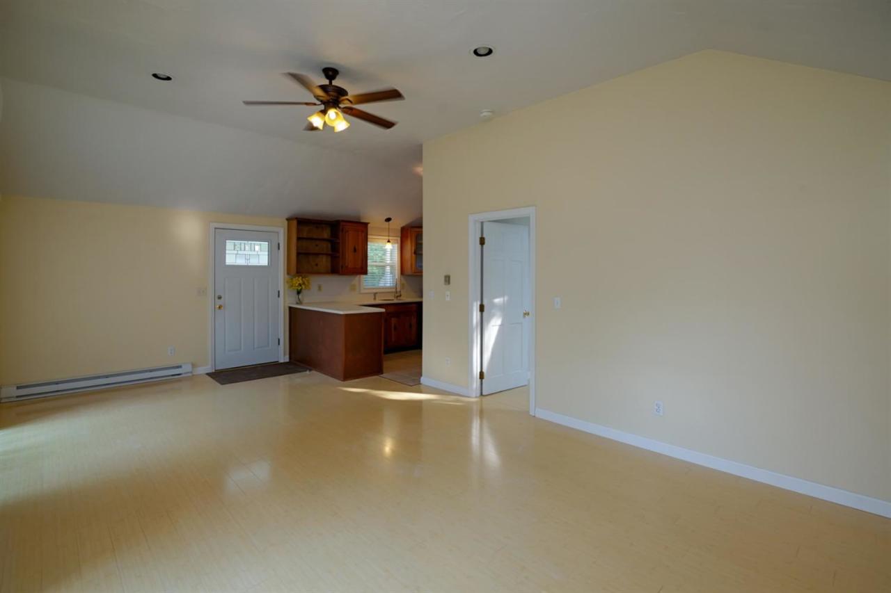 12 Santuit Pond Road Mashpee, MA 02649 - Photo 15 of 31 an empty room with closet and a ceiling fan