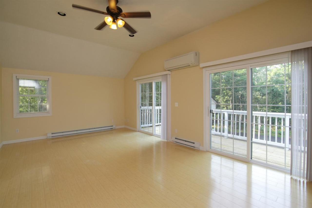 12 Santuit Pond Road Mashpee, MA 02649 - Photo 17 of 31 a view of an empty room with a window