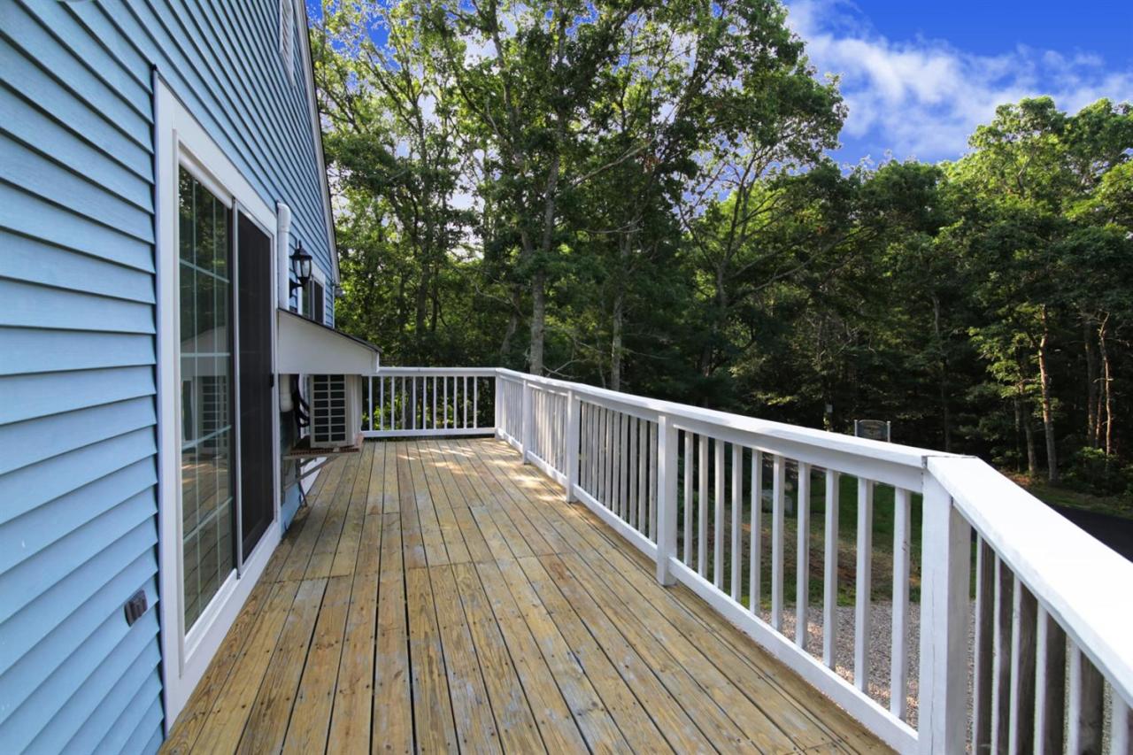 12 Santuit Pond Road Mashpee, MA 02649 - Photo 21 of 31 a view of balcony of a house