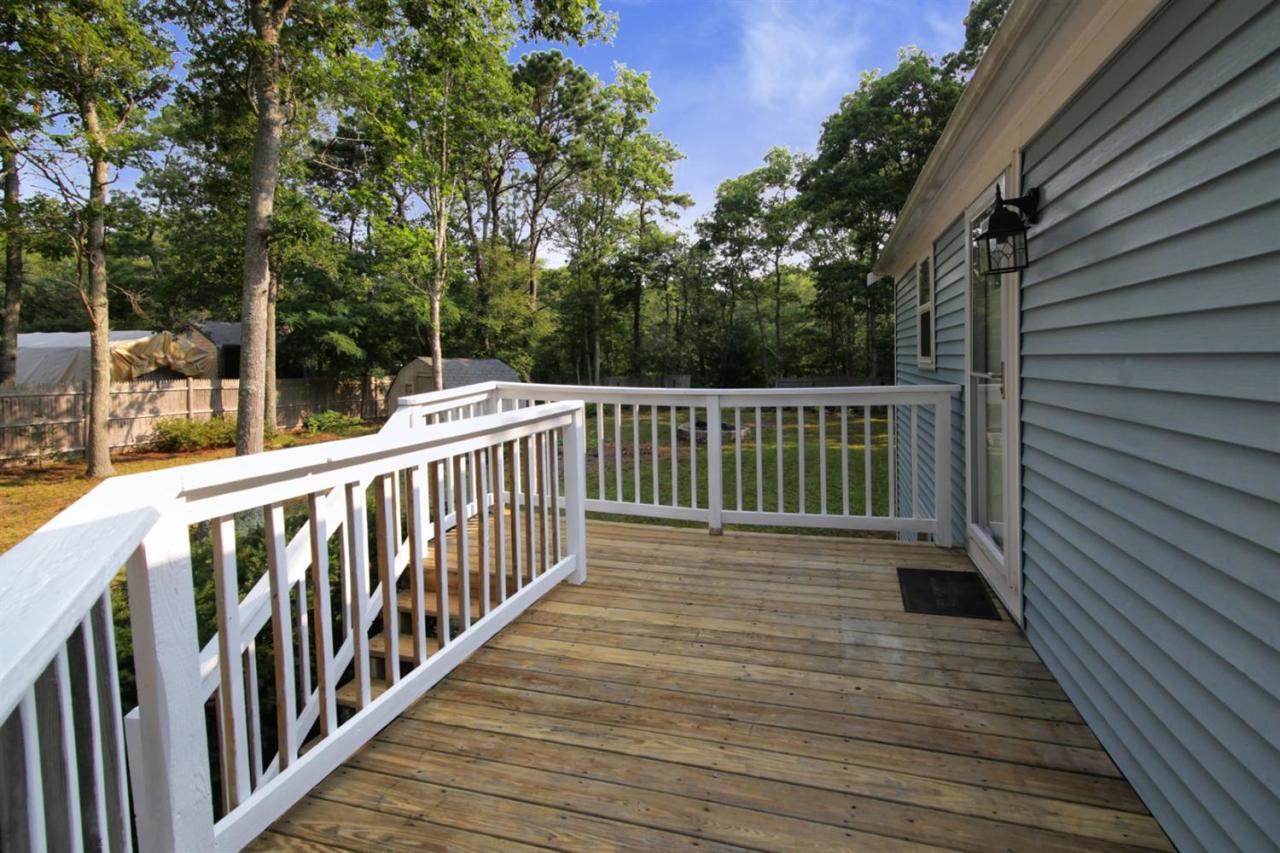 12 Santuit Pond Road Mashpee, MA 02649 - Photo 23 of 31 a view of deck and deck with wooden floor and fence