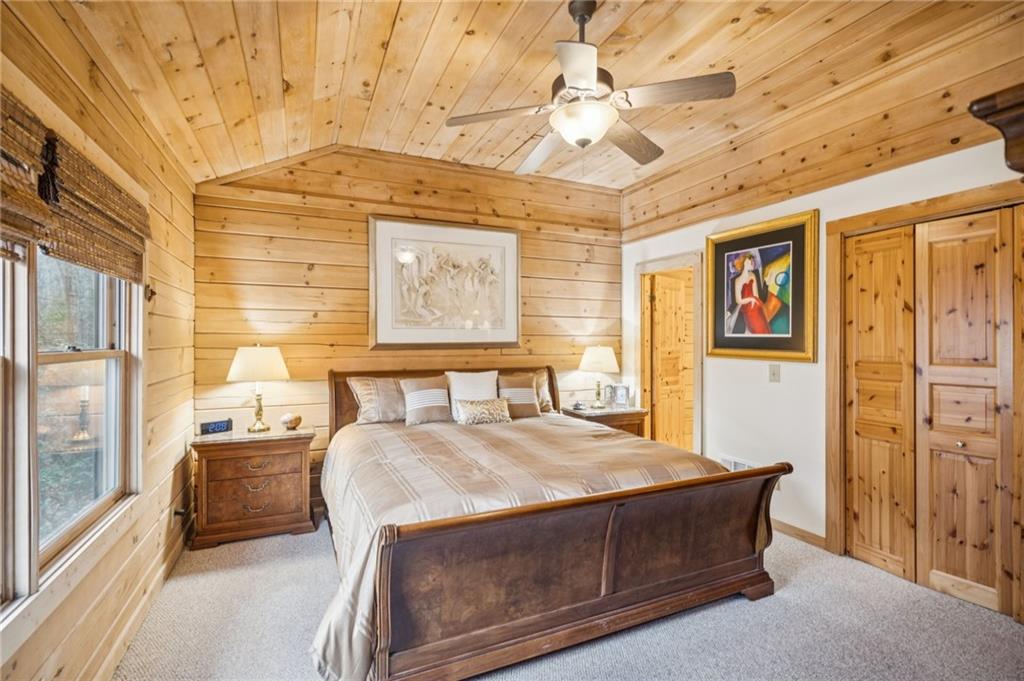 458 Tea Berry Lane Big Canoe, GA 30143 - Photo 13 of 37 a living room with stainless steel appliances furniture a fireplace and a large window