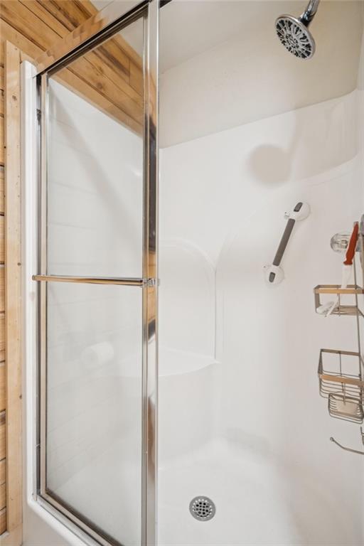 458 Tea Berry Lane Big Canoe, GA 30143 - Photo 16 of 37 a bathroom with a glass shower door