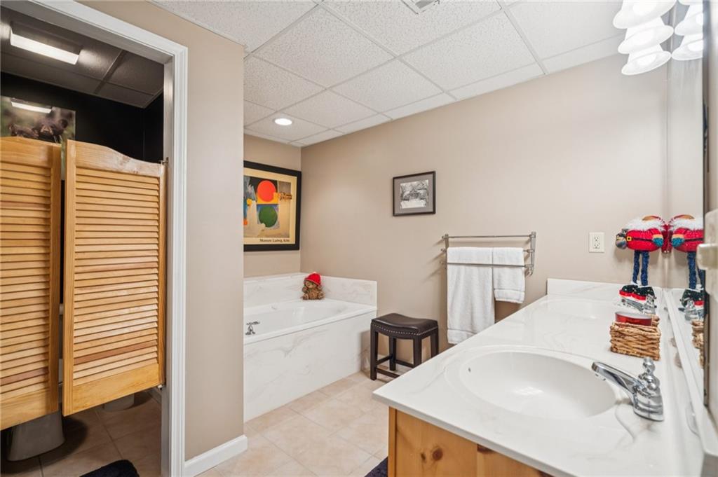 458 Tea Berry Lane Big Canoe, GA 30143 - Photo 27 of 37 a white kitchen with a sink and a refrigerator