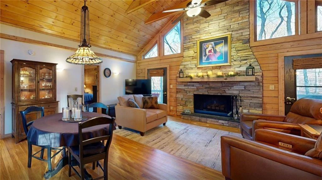 458 Tea Berry Lane Big Canoe, GA 30143 - Photo 3 of 37 a living room with furniture a fireplace and a chandelier