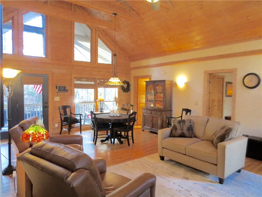 458 Tea Berry Lane Big Canoe, GA 30143 - Photo 6 of 37 a living room with furniture and a large window