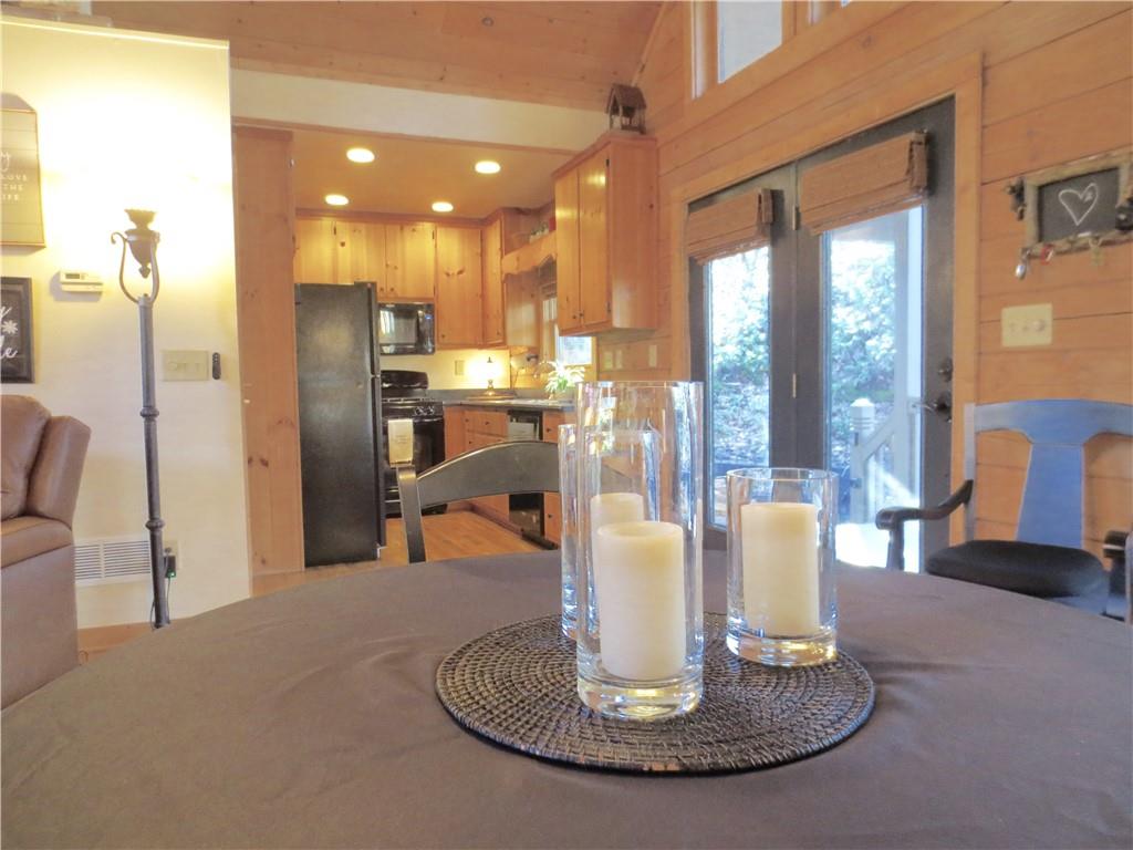 458 Tea Berry Lane Big Canoe, GA 30143 - Photo 7 of 37 a kitchen with a table and chairs