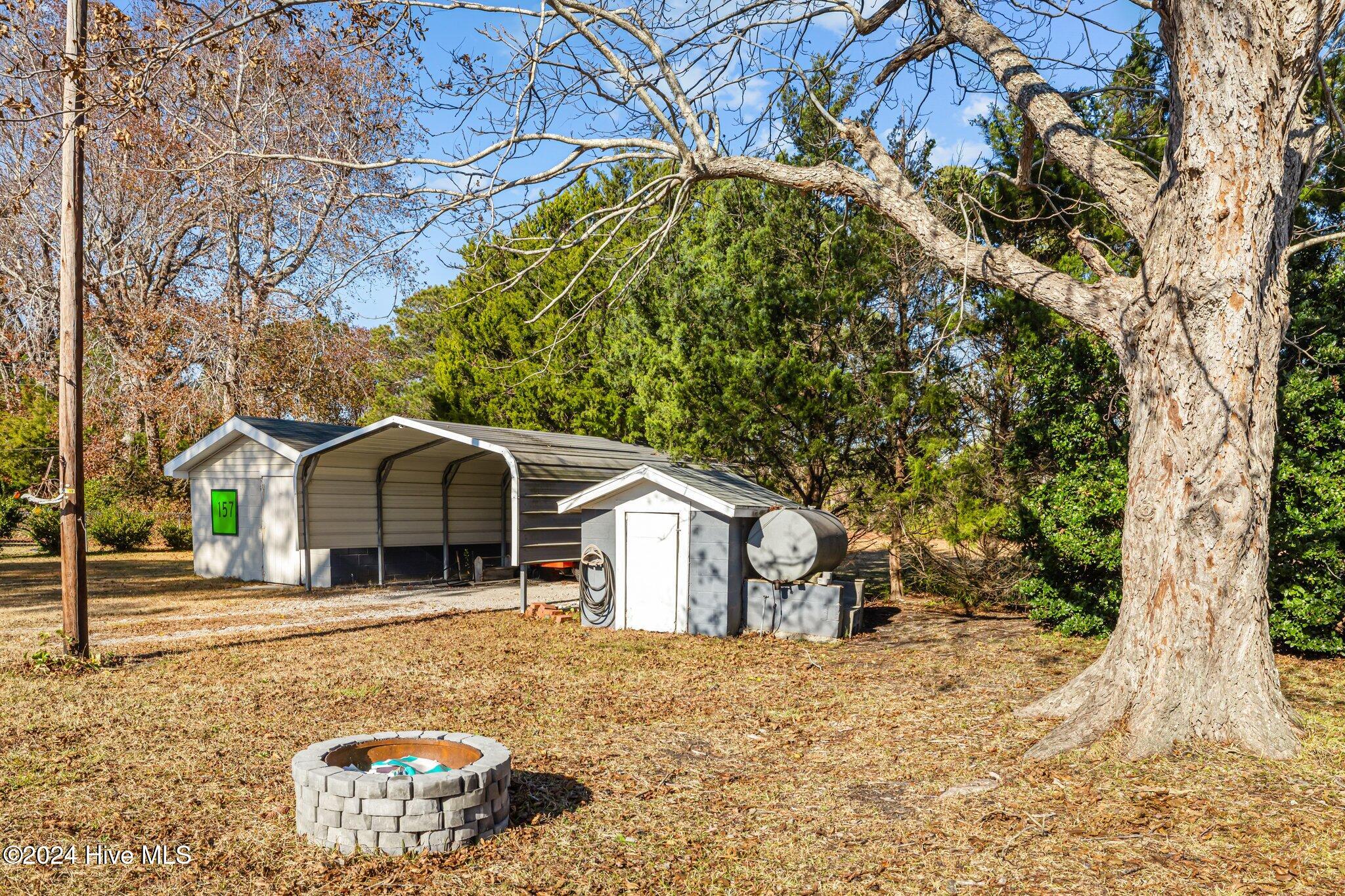 157 Arthur Road Beaufort, NC 28516 - Photo 35 of 48 Car Shelter, Work Shed and Firepit in the back yard