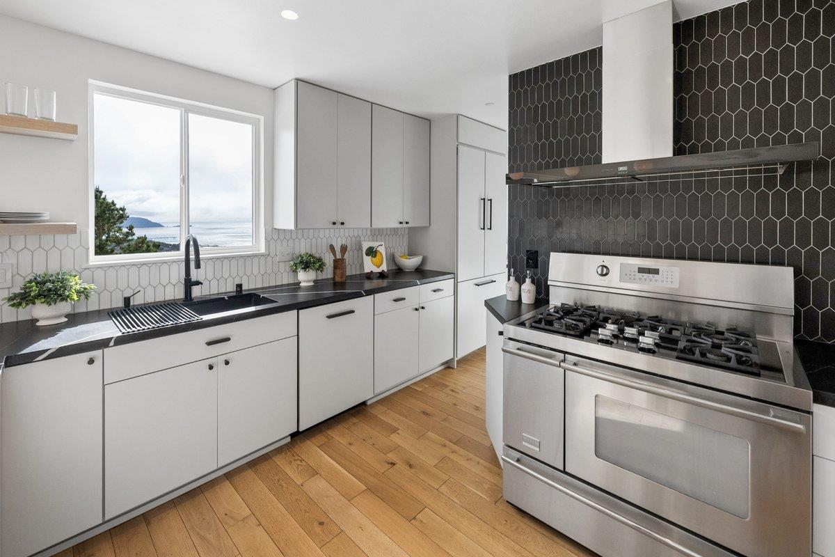 170 Beachview Avenue Pacifica, CA 94044 - Photo 48 of 85 a kitchen with white cabinets and appliances